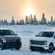 A photo of two Ford F-150 Lightning trucks.